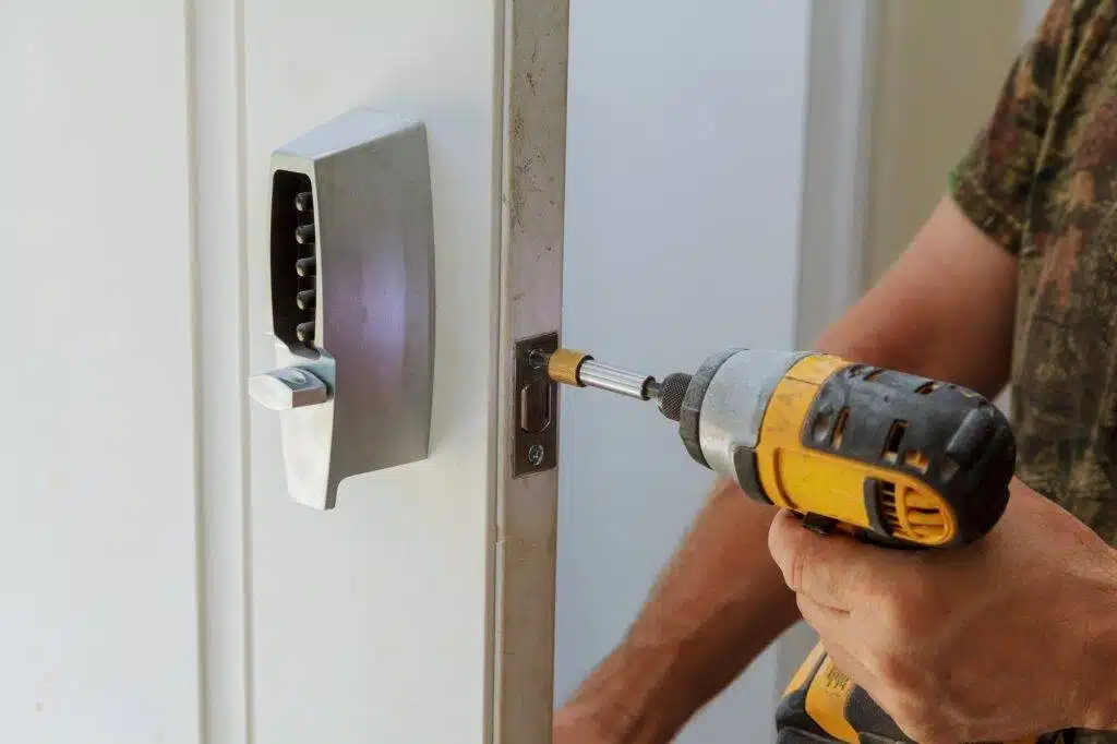 man-installing-of-the-door-with-lock-key-security-1024x682
